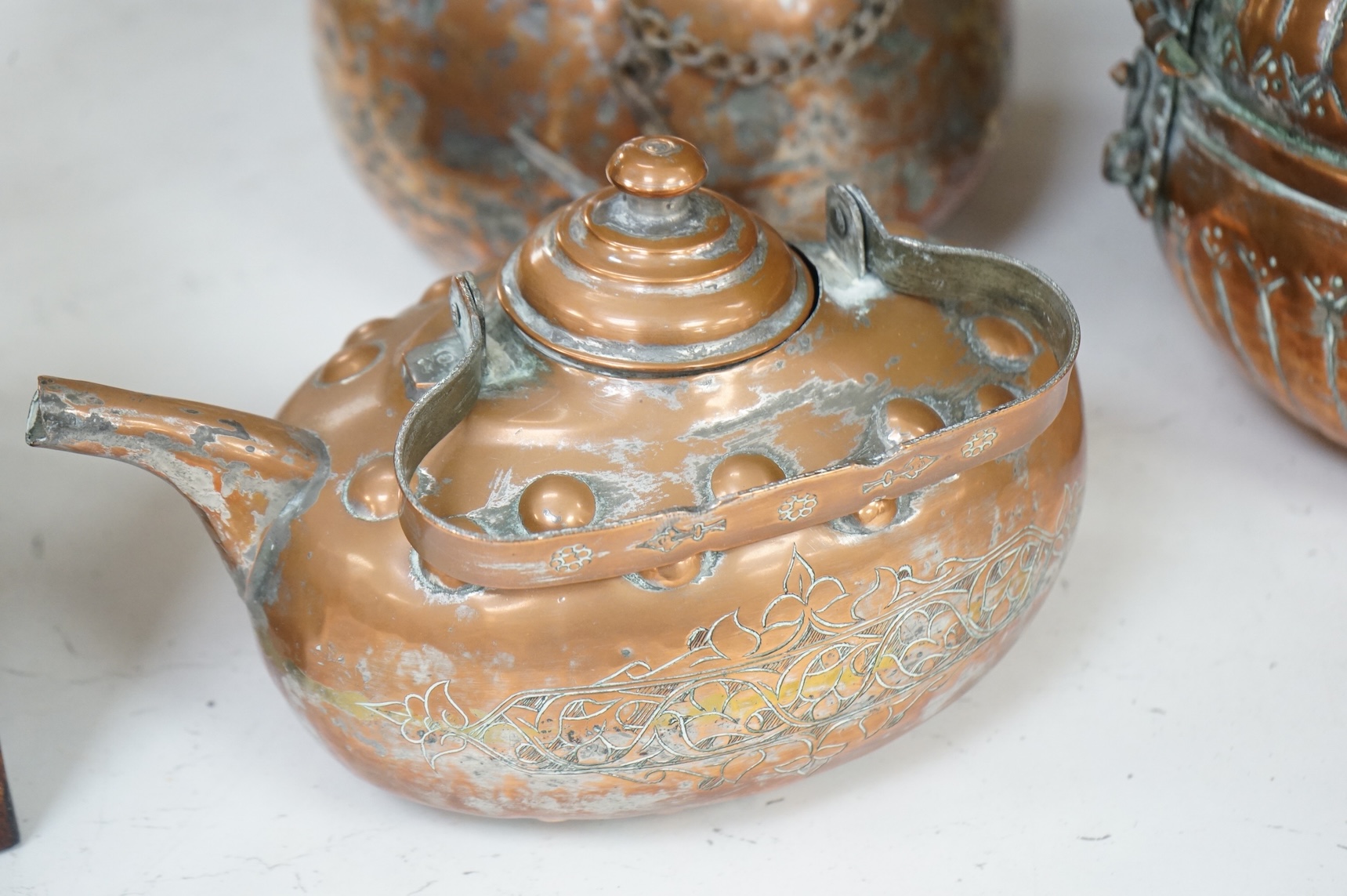 A collection of six various Arab copper vessels to include coffee pots, tallest 37cm